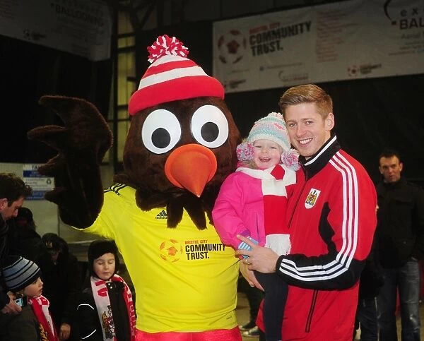 Bristol City's Jon Stead and Daughter Share a Moment with Scrumpy at Ashton Gate