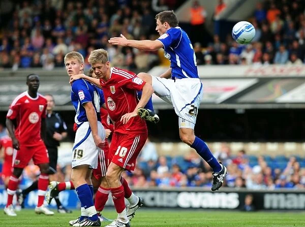 Bristol City's Jon Stead Fights for Aerial Ball Amidst Ipswich Defenders Tommy Smith and Luke Hyam, Championship Match, August 2010
