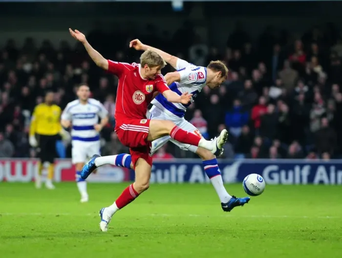 Framed Print : Bristol City's Jon Stead Fouled by QPR's Kaspars Gorkss in Championship Match Framed Print : Bristol City's Jon Stead Fouled by QPR's Kaspars Gorkss in Championship Match