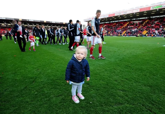 Framed Print : Bristol City's Jon Stead Shares a Special Moment with Daughter at Ashton Gate Stadium during Bristol City v Barnsley Match Framed Print : Bristol City's Jon Stead Shares a Special Moment with Daughter at Ashton Gate Stadium during Bristol City v Barnsley Match