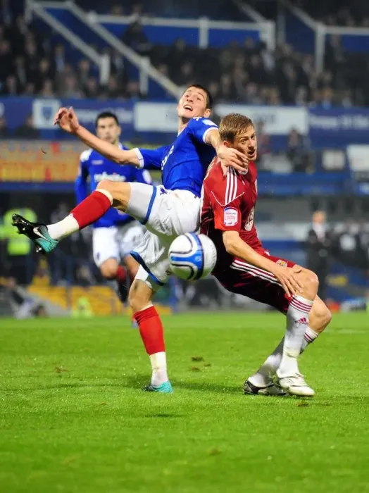 Framed Print : Bristol City's Jon Stead vs. Portsmouth's Joel Ward: Championship Clash at Fratton Park (September 2010)