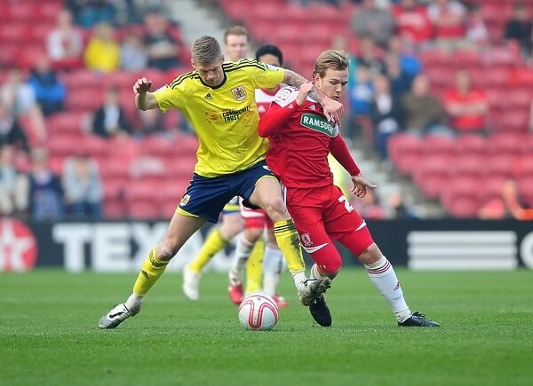 Bristol City's Jon Stead vs. Middlesbrough's Malaury Martin: A Battle for the Ball at Riverside Stadium, 2012