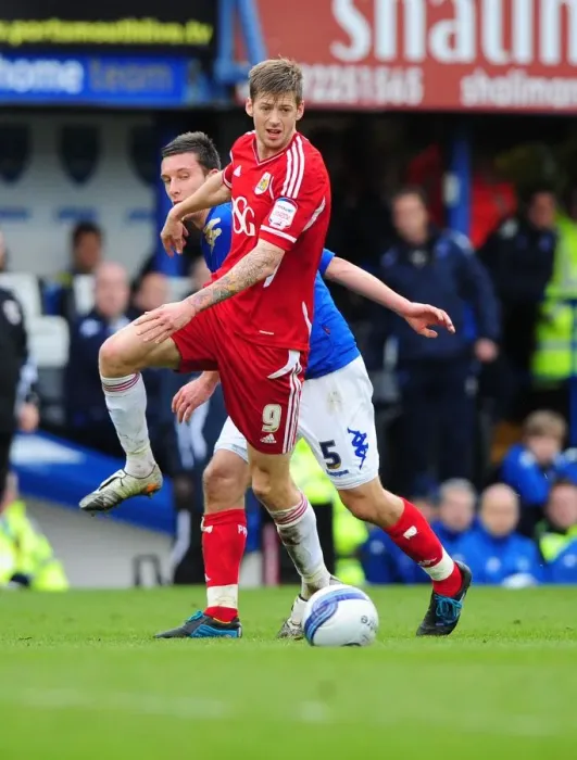 Framed Print : Bristol City's Jon Stead vs Portsmouth's Jason Pearce: Battle for the Ball at Fratton Park, 2012