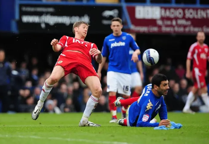 Framed Print : Bristol City's Jon Stead vs. Portsmouth's Ricardo Rocha: A Battle for the Ball at Fratton Park, 2012