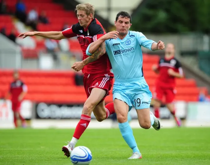 Framed Print : Bristol City's Jon Stead vs St Johnstone's Gary Miller - Football Rivalry at McDiarmid Park (Pre-Season Friendly, 2012)