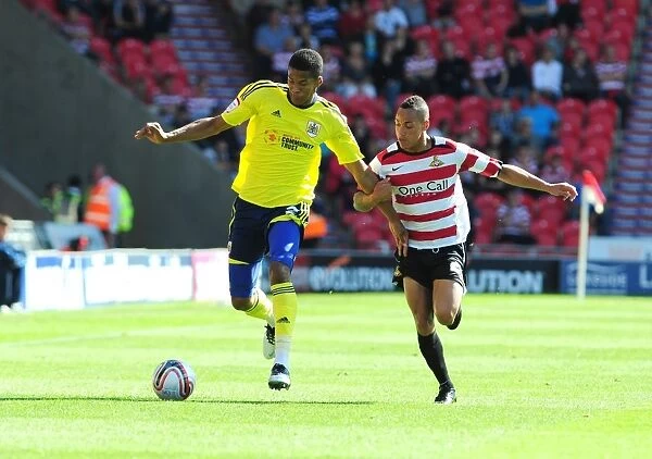 Bristol City's Jordan Spence vs. Kyle Bennett in League Cup Clash at Doncaster Rovers - 27 / 08 / 2011