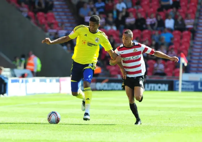 Framed Print : Bristol City's Jordan Spence vs. Kyle Bennett in League Cup Clash at Doncaster Rovers - 27 / 08 / 2011