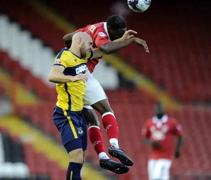 Framed Print : Bristol City's Jordan Wynter Outmuscles Oxford United's Tom Newey for the Ball in Capital One Cup Clash