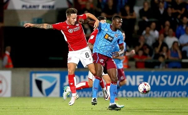 Bristol City's Josh Brownhill Tackles Hakeeb Adelakun in EFL Cup Clash at Scunthorpe United