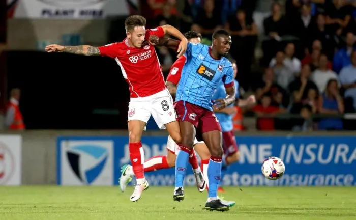 Framed Print : Bristol City's Josh Brownhill Tackles Hakeeb Adelakun in EFL Cup Clash at Scunthorpe United