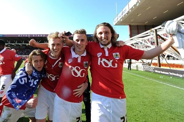 Bristol City's Jubilant Win: Luke Freeman, George Saville, Joe Bryan, and Luke Ayling Celebrate Promotion to Sky Bet League One