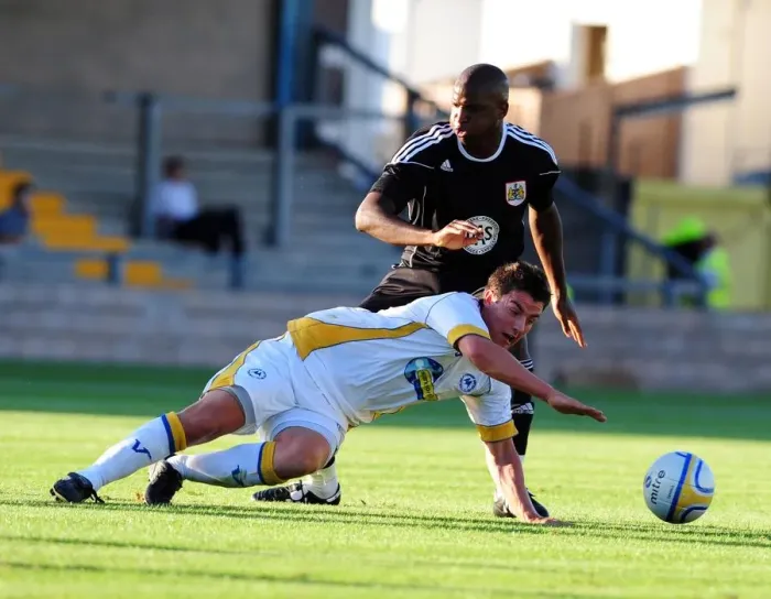 Framed Print : Bristol Citys Kalifa Cisse battles for the ball with Torquays Elliot Benyon Framed Print : Bristol Citys Kalifa Cisse battles for the ball with Torquays Elliot Benyon