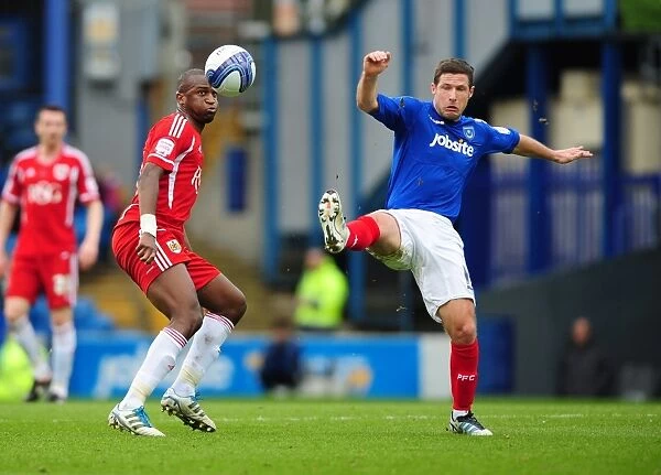 Bristol City's Kalifa Cisse Defies Gravity: Soaring Over Portsmouth's David Norris in a Memorable Football Moment
