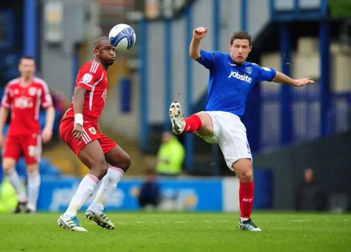 Framed Print : Bristol City's Kalifa Cisse Defies Gravity: Soaring Over Portsmouth's David Norris in a Memorable Football Moment