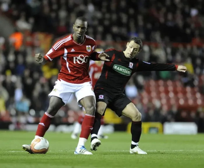 Framed Print : Bristol City's Kalifa Cisse Fends Off Scott McDonald in Bristol City v Middlesbrough Match, December 2011