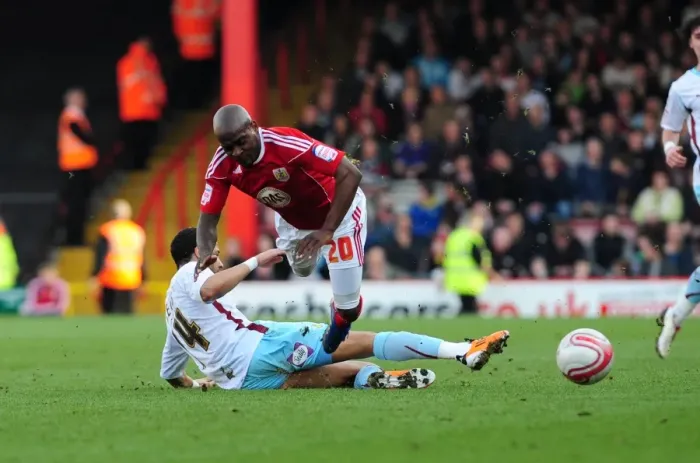 Framed Print : Bristol City's Kalifa Cisse Foul by Tyrone Mears during Championship Match, March 19, 2011