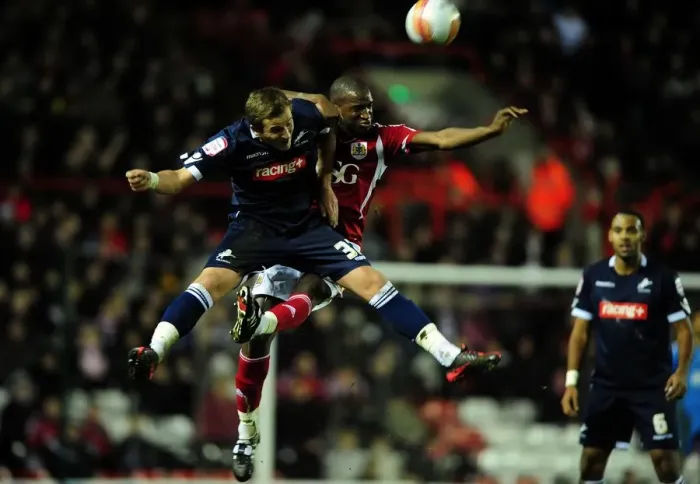 Framed Print : Bristol City's Kalifa Cisse vs. Harry Kane: A Battle for the High Ball in the 2012 Championship Match between Bristol City and Millwall