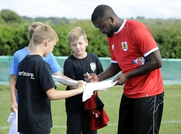 Bristol City's Karleigh Osborne Interacts with Young Fans at Portishead Town Pre-Season Match