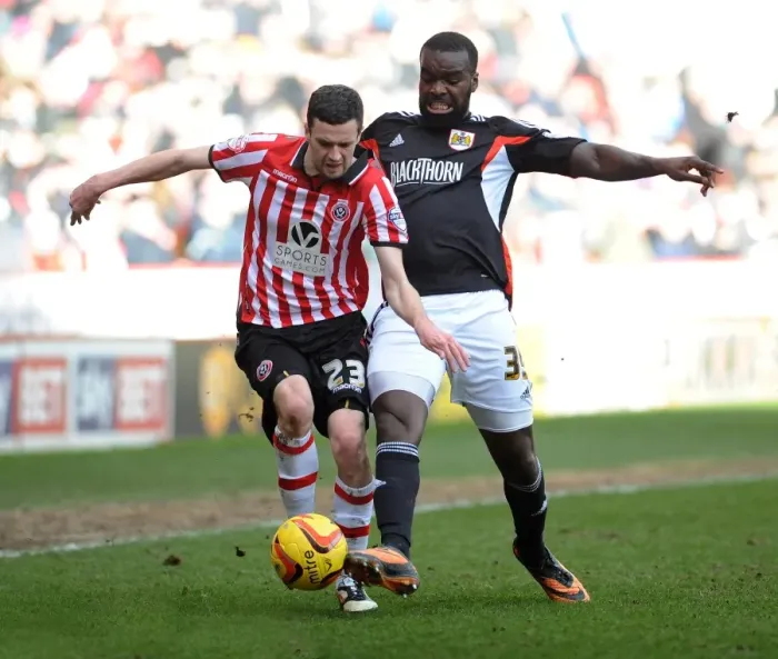 Framed Print : Bristol City's Karleigh Osborne vs Sheffield United's Jamie Murphy - Intense Battle for Possession in Sky Bet League One (Sheffield United v Bristol City, 2014) Framed Print : Bristol City's Karleigh Osborne vs Sheffield United's Jamie Murphy - Intense Battle for Possession in Sky Bet League One (Sheffield United v Bristol City, 2014)