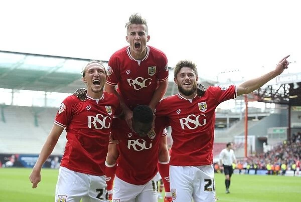 Bristol City's Kieran Agard Celebrates Double Strike with Teammates Luke Ayling, Joe Bryan, and Wes Burns during Bristol City vs Walsall Football Match, May 2015