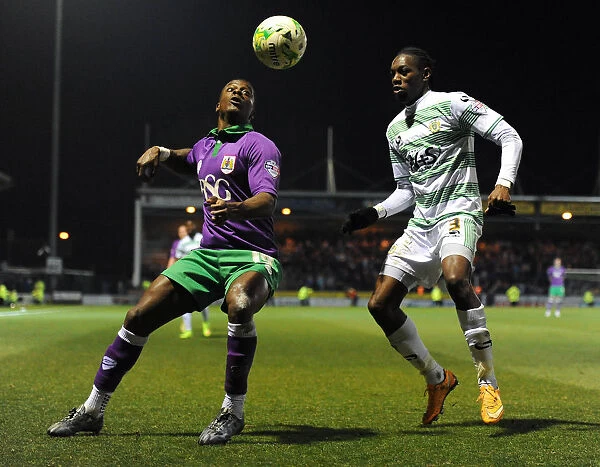 Bristol City's Kieran Agard Closes In on Yeovil Town's Nathan Smith in Sky Bet League One Clash