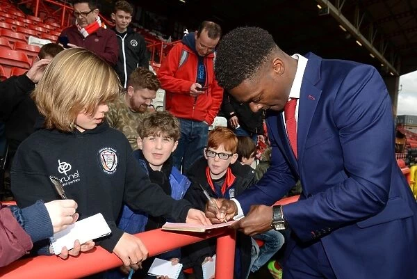 Bristol City's Kieran Agard Signs Autographs for Adoring Fans at Ashton Gate Stadium