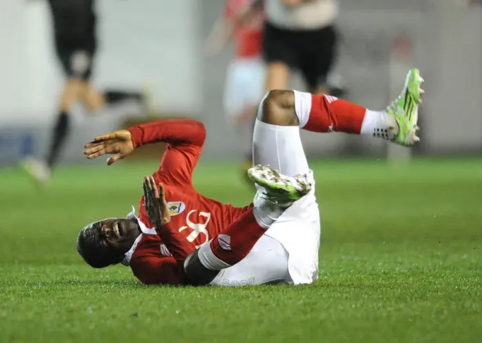 Framed Print : Bristol City's Kieran Agard Suffers Injury in Action Against Peterborough United Framed Print : Bristol City's Kieran Agard Suffers Injury in Action Against Peterborough United