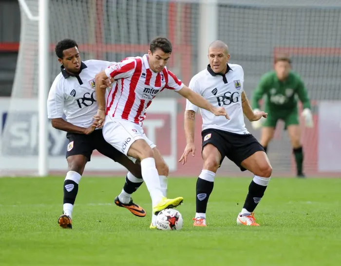 Framed Print : Bristol City's Korey Smith and Adam El-Abd Clash with Cheltenham Town's Terry Gornell in Pre-Season Friendly
