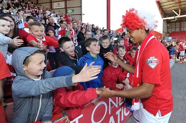 Bristol City's Korey Smith Celebrates League Victory with Ecstatic Fans