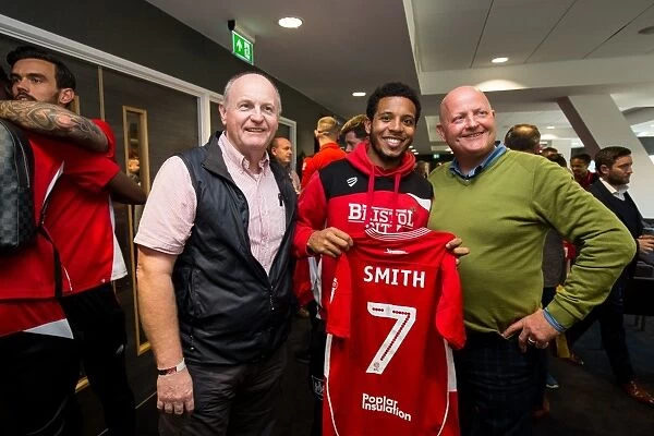 Bristol City's Korey Smith Presents Sponsors with Signed Shirt after Championship Match vs. Birmingham City