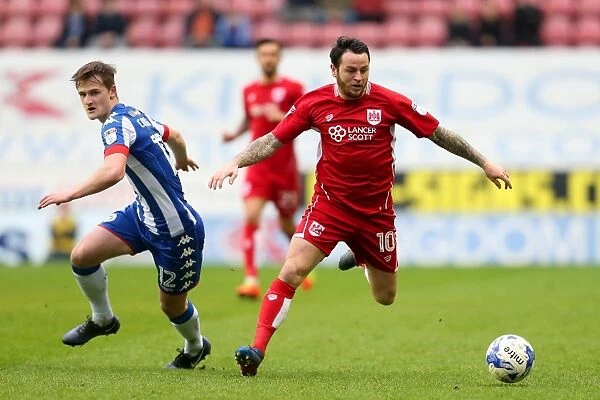 Bristol City's Lee Tomlin Clashes with Wigan Athletic's Callum Connolly during Sky Bet Championship Match