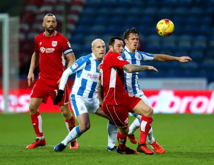 Framed Print : Bristol City's Lee Tomlin Faces Off Against Huddersfield Town's Aaron Mooy in Championship Clash Framed Print : Bristol City's Lee Tomlin Faces Off Against Huddersfield Town's Aaron Mooy in Championship Clash