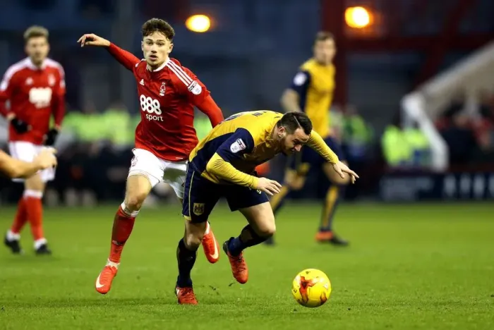 Framed Print : Bristol City's Lee Tomlin Fouled by Nottingham Forest's Matty Cash during Sky Bet Championship Match Framed Print : Bristol City's Lee Tomlin Fouled by Nottingham Forest's Matty Cash during Sky Bet Championship Match