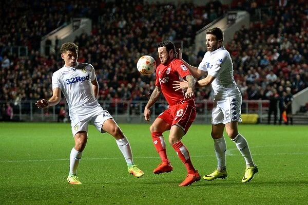 Bristol City's Lee Tomlin Holds Off Leeds United Defenders During Sky Bet Championship Match