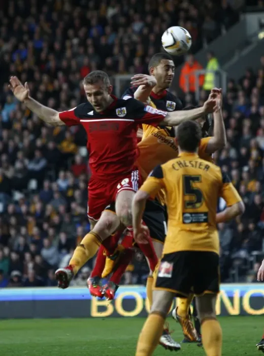 Framed Print : Bristol City's Lewin Nyatanga Soars High in Championship Clash vs Hull City (April 2013)