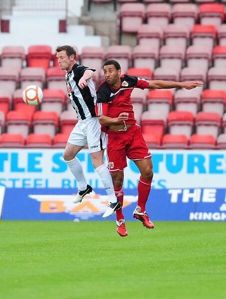Bristol City's Lewin Nyatanga vs. Andy Kirk: Aerial Battle in Dunfermline Friendly