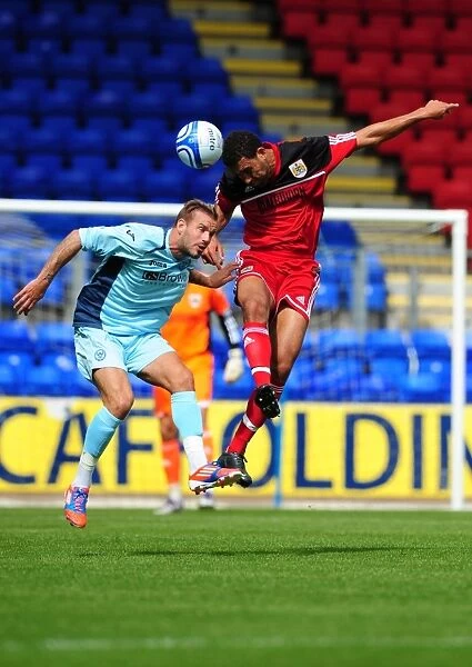 Bristol City's Lewin Nyatanga Wins the High Ball in Pre-Season Friendly against St Johnstone