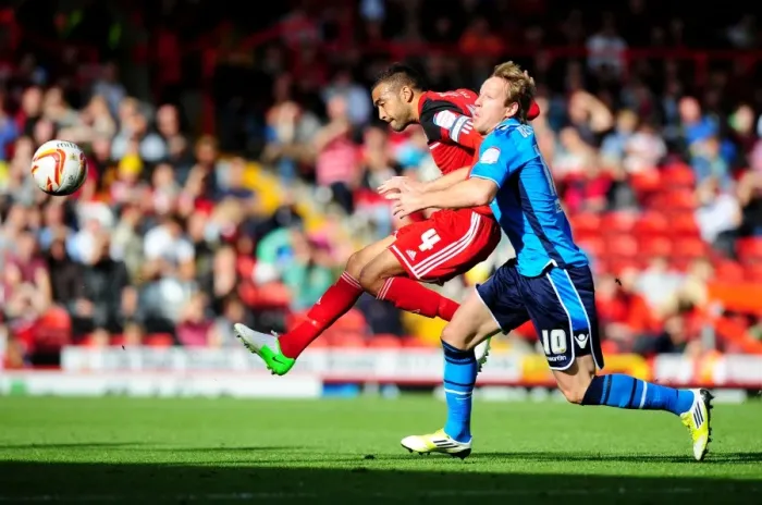 Framed Print : Bristol City's Liam Fontaine Blocks Shot from Leeds United's Luciano Becchio in Championship Match