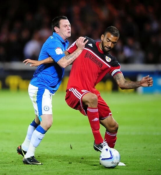 Bristol City's Liam Fontaine Fouled by Lee Tomlin in Peterborough United Match