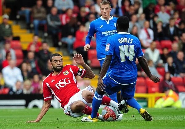 Bristol City's Liam Fontaine Tackles Morgaro Gomis in Championship Match vs Birmingham City - October 23, 2011