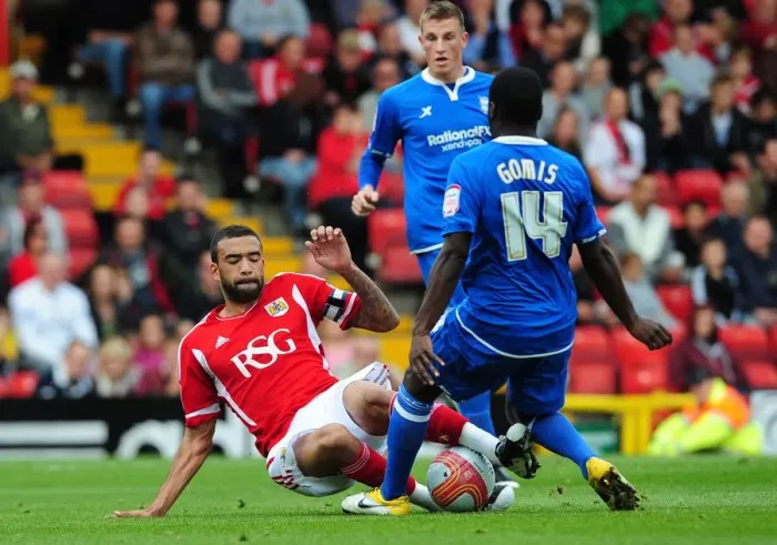 Framed Print : Bristol City's Liam Fontaine Tackles Morgaro Gomis in Championship Match vs Birmingham City - October 23, 2011
