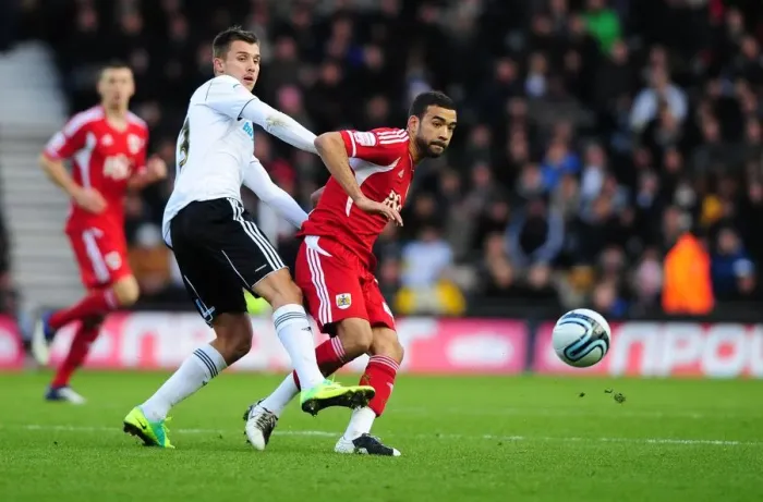 Framed Print : Bristol City's Liam Fontaine vs. Tamas Priskin in Championship Clash at Derby County - 10 / 12 / 2011