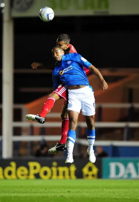 Framed Print : Bristol City's Liam Fontaine vs. Tyrone Barnett in Intense Aerial Battle during Peterborough United vs. Bristol City Championship Match Framed Print : Bristol City's Liam Fontaine vs. Tyrone Barnett in Intense Aerial Battle during Peterborough United vs. Bristol City Championship Match