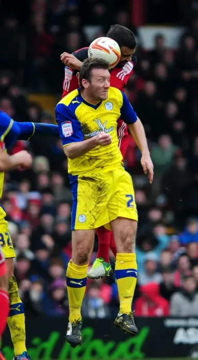 Framed Print : Bristol City's Liam Fontaine vs. Sheffield Wednesday's Steve Howard: A Heading Duel in the Npower Championship, April 2013