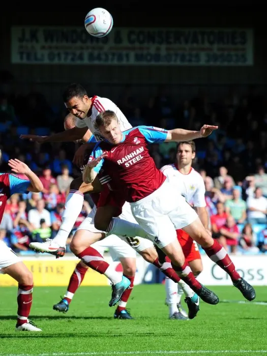 Framed Print : Bristol City's Liam Fontaine vs Scunthorpe's Michael O'Connor: Aerial Battle in Championship Match, September 11, 2010