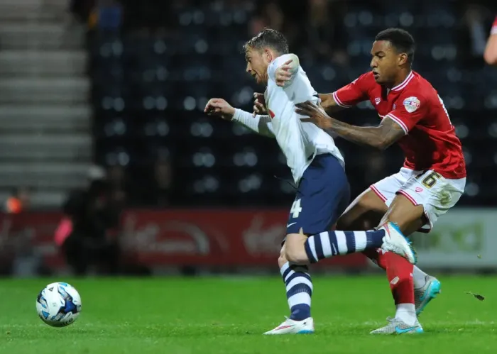Framed Print : Bristol City's Liam Moore Closes In on Preston North End's Joe Garner Framed Print : Bristol City's Liam Moore Closes In on Preston North End's Joe Garner