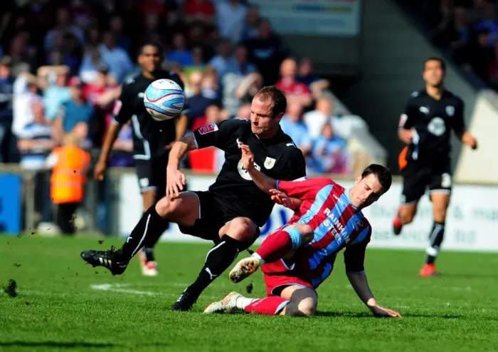Framed Print : Bristol City's Louis Carey Clashes with Cliff Byrne of Scunthorpe United in Championship Battle, 17th April 2010