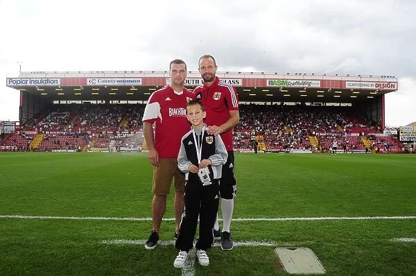 Bristol City's Louis Carey Holds the Blackthorn Trophy after Winning against Bradford City, August 2013