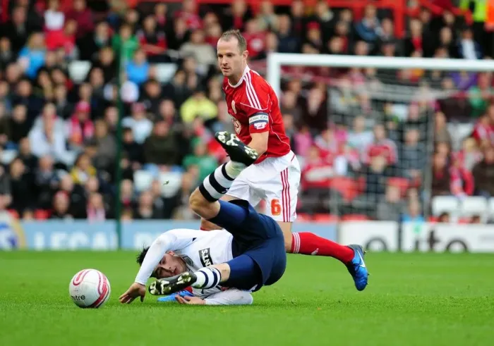 Framed Print : Bristol City's Louis Carey Tackles Keith Treacy in Intense Championship Clash at Ashton Gate Stadium (06 / 11 / 2010)