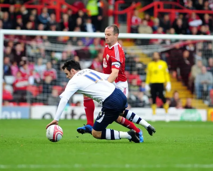 Framed Print : Bristol City's Louis Carey Tackles Preston's Keith Treacy in Championship Clash at Ashton Gate Stadium (Bristol City v Preston North End, 06 / 11 / 2010)